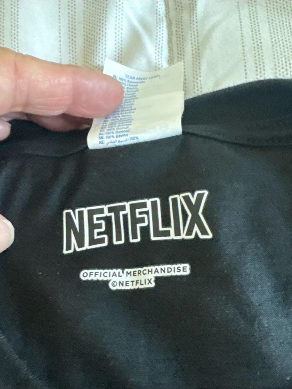 Netflix Black T‑Shirt with Lavender Print